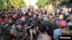 A scuffle between police officers and protesters in Republic Square, Yerevan, August 8, 2023.