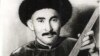 Атай Огомбаев төрт кыл комузу менен, 1939-жыл.