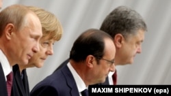 Belarus -- (L-R) Russian President Vladimir Putin, German Chancellor Angela Merkel, French President Francois Hollande and Ukrainian President Petro Poroshenko pose during for a group photo during the Ukraine peace talks in Minsk, February 11, 2015